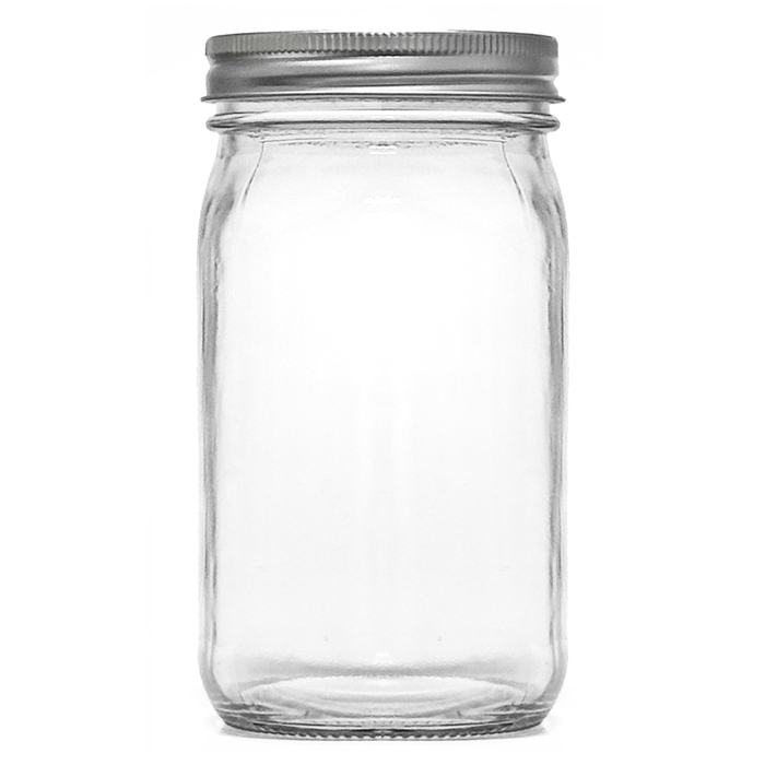 Clear glass mason jar with a silver metal lid on a white background