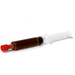 Syringe with red cap and brown ALDC liquid on a white background