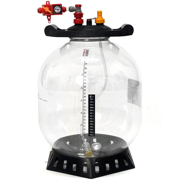 Clear pressure fermenter with black base and red and yellow carbonation caps on a white background