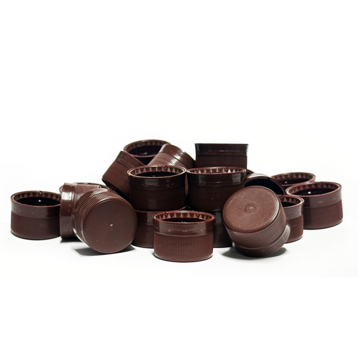 Collection of brown plastic PET bottle lids on a white background